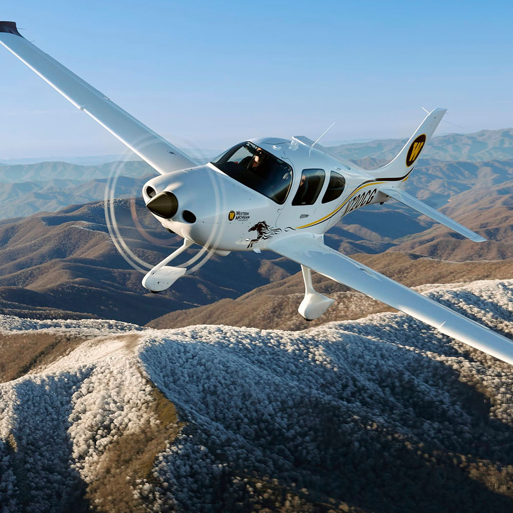 Artboard 12 small private plane over mountains