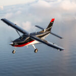 Thumbnail of kodiak plane flying over water