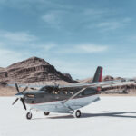 Thumbnail of kodiak plane sitting on salt flats