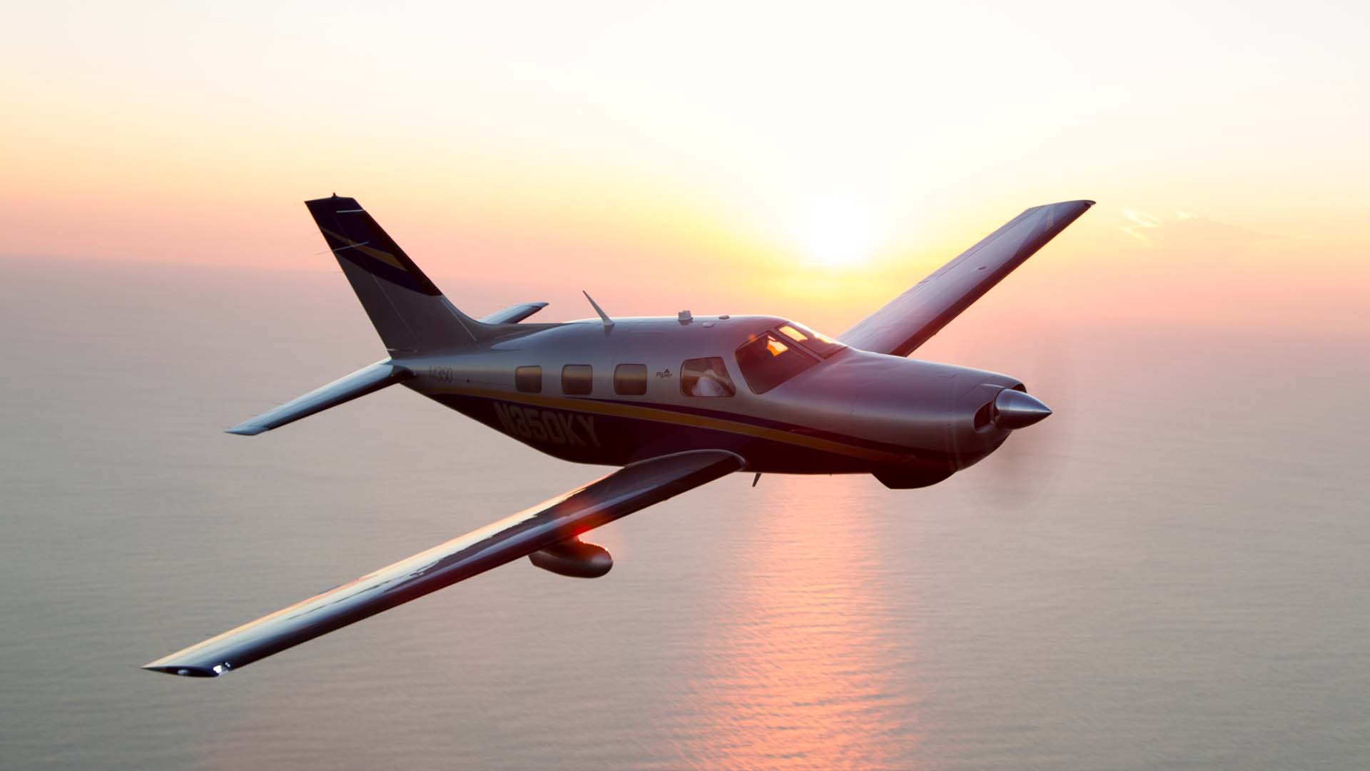 Artboard 18 private airplane flying over water