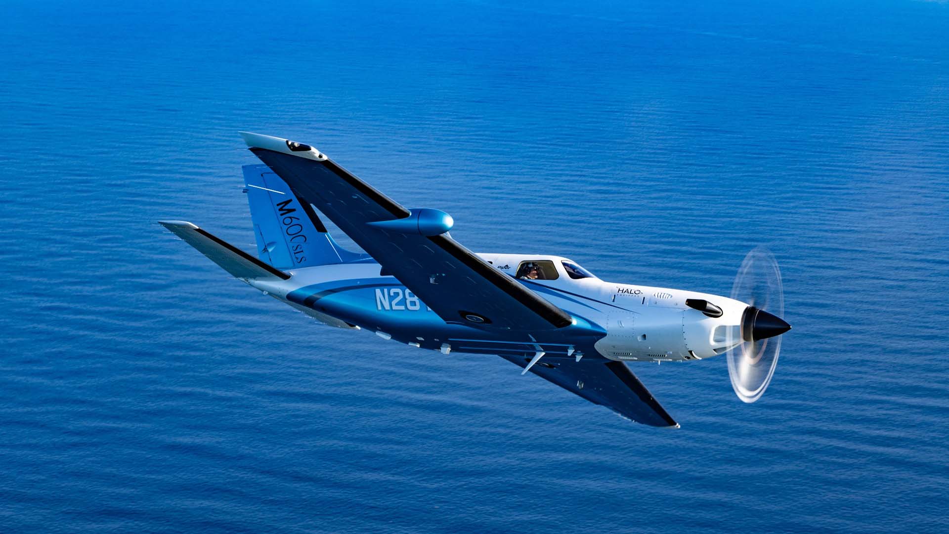 Artboard 21 private plane flying over water